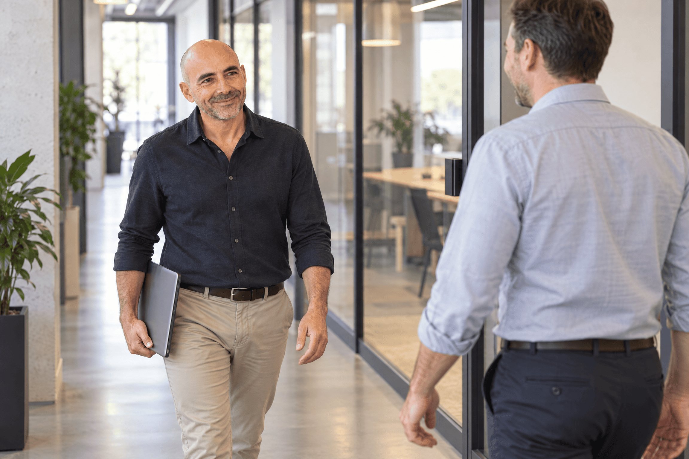 Paul D'Ambra walking towards a client to have a meeting about their marketing